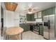 The kitchen features tile flooring, granite countertops, and stainless steel appliances at 10839 Carrol Ln, Northglenn, CO 80233