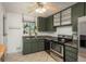 The kitchen features tile flooring, granite countertops, and stainless steel appliances at 10839 Carrol Ln, Northglenn, CO 80233