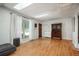Open living room with hardwood floors, natural lighting, and modern decor at 10839 Carrol Ln, Northglenn, CO 80233