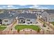 Aerial view of backyard featuring lush lawn, patio, and xeriscaping with a wooden fence at 16840 New Autumn Dr, Monument, CO 80132