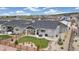 Aerial view of backyard featuring lush lawn, patio, and xeriscaping with a wooden fence at 16840 New Autumn Dr, Monument, CO 80132