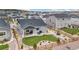 Aerial view of backyard featuring lush lawn, patio, and xeriscaping with a wooden fence at 16840 New Autumn Dr, Monument, CO 80132