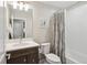 Inviting bathroom featuring a vanity with a sink, a toilet, and a shower with tub combo at 16840 New Autumn Dr, Monument, CO 80132