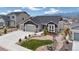 Charming gray home with a three car garage and beautifully xeriscaped front yard at 16840 New Autumn Dr, Monument, CO 80132