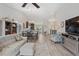 Open-concept floor plan with living room, dining area, and kitchen featuring hardwood floors and ample space at 16840 New Autumn Dr, Monument, CO 80132