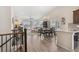 Open-concept living space featuring hardwood floors, a fireplace, and large windows for mountain views at 16840 New Autumn Dr, Monument, CO 80132