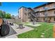 Backyard green space offering outdoor dining and seating for relaxing in a beautiful environment at 558 N Washington St # 305, Denver, CO 80203