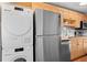 Bright kitchen featuring stainless steel appliances, light wood cabinets and white subway tile backsplash at 558 N Washington St # 305, Denver, CO 80203