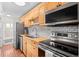 Well-equipped kitchen featuring stainless steel appliances, butcher block counters, and subway tile backsplash at 558 N Washington St # 305, Denver, CO 80203
