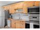 Modern kitchen showcasing stainless steel appliances, butcher block countertops, and ample cabinet space at 558 N Washington St # 305, Denver, CO 80203