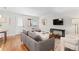 Comfortable living room with a stylish sofa, hardwood floors, and easy access to the front door at 558 N Washington St # 305, Denver, CO 80203
