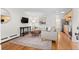 Cozy living room featuring a comfortable couch, media center, and an open floor plan at 558 N Washington St # 305, Denver, CO 80203