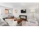 Well-lit living room featuring stylish seating, hardwood floors, and a large window at 558 N Washington St # 305, Denver, CO 80203