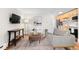 Inviting living room with contemporary decor, a sleek TV console, and easy access to the kitchen at 558 N Washington St # 305, Denver, CO 80203