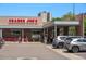A Trader Joe's grocery store front, with parking and shoppers, on a sunny day at 558 N Washington St # 305, Denver, CO 80203
