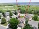 A tranquil neighborhood with mature trees and a beautiful view corridor to the lake at 9610 S Dover Way, Littleton, CO 80127