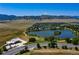 Aerial view of neighborhood showing pond and mountain backdrop at 9610 S Dover Way, Littleton, CO 80127