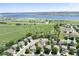Aerial view of homes showing nearby lake and surrounding green space at 9610 S Dover Way, Littleton, CO 80127