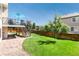 Spacious, green backyard with a well-maintained lawn and a charming stone pathway at 9610 S Dover Way, Littleton, CO 80127