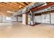 Unfinished basement showing exposed utilities and insulated walls at 9610 S Dover Way, Littleton, CO 80127