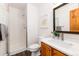 Clean bathroom featuring a shower, vanity, and a mirror at 9610 S Dover Way, Littleton, CO 80127