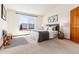 Bedroom with decor, and a large window at 9610 S Dover Way, Littleton, CO 80127