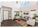 Spacious living room with high ceilings, natural light, and modern decor create a welcoming space at 9610 S Dover Way, Littleton, CO 80127