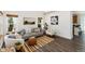 Bright living room with neutral tones, stylish furniture, and ample natural light from the windows at 9610 S Dover Way, Littleton, CO 80127