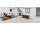 Basement features carpet, a neutral couch, and comfortable seating at 417 S Pontiac Way, Denver, CO 80210