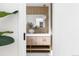 Stylish bathroom vanity with a vessel sink, wood paneling, and modern fixtures at 417 S Pontiac Way, Denver, CO 80210