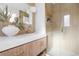 Modern bathroom featuring a sink, vanity, quartz countertop, gold hardware, and a glass shower with matching tile at 417 S Pontiac Way, Denver, CO 80210