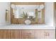 Bathroom featuring double sinks, quartz countertops, gold hardware, and a large mirror at 417 S Pontiac Way, Denver, CO 80210