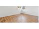 Bedroom with hardwood floors, white walls and natural light from windows at 417 S Pontiac Way, Denver, CO 80210