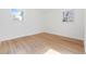 Bedroom with hardwood floors, white walls and natural light from windows at 417 S Pontiac Way, Denver, CO 80210