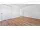 Bedroom with hardwood floors and white walls, and double door closet at 417 S Pontiac Way, Denver, CO 80210