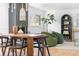 Inviting living room featuring hardwood floors, a painted brick fireplace, comfortable seating, and stylish decor at 417 S Pontiac Way, Denver, CO 80210