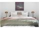 Cozy main bedroom with a comfortable bed, decorative pillows, and bedside tables at 417 S Pontiac Way, Denver, CO 80210
