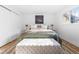 Serene main bedroom with a comfortable bed, soft rug, and white walls at 417 S Pontiac Way, Denver, CO 80210