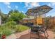 Private backyard with patio, artificial turf, and garden at 1217 Osceola St, Denver, CO 80204