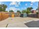 Large backyard with storage shed and paved parking area at 1217 Osceola St, Denver, CO 80204