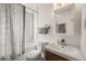 Modern bathroom featuring a stylish vanity, a shower, and updated fixtures at 1217 Osceola St, Denver, CO 80204