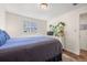 Bright bedroom with a queen bed and wood floors at 1217 Osceola St, Denver, CO 80204