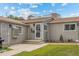 Charming single-story home featuring a secure screen door and quaint front yard landscaping at 1217 Osceola St, Denver, CO 80204