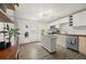 Bright, modern kitchen featuring sleek cabinetry, stainless steel appliances, and an island at 1217 Osceola St, Denver, CO 80204