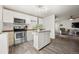 Updated kitchen with light cabinets and wood countertops at 1217 Osceola St, Denver, CO 80204