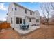 Backyard offers a concrete patio with outdoor seating, and a neutral-colored two-story home exterior at 2918 W 135Th Pl, Thornton, CO 80241