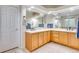 Bright bathroom features tile floors, double sinks, wood cabinets and a large mirror at 2918 W 135Th Pl, Thornton, CO 80241
