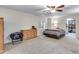 Comfortable bedroom featuring a ceiling fan, dresser, and closet with built-in shelving for ample storage at 2918 W 135Th Pl, Thornton, CO 80241