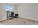 This home office bedroom is ready for work with a comfortable desk and an office chair at 2918 W 135Th Pl, Thornton, CO 80241