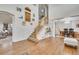 Bright foyer featuring hardwood floors, high ceilings, and staircase at 2918 W 135Th Pl, Thornton, CO 80241
